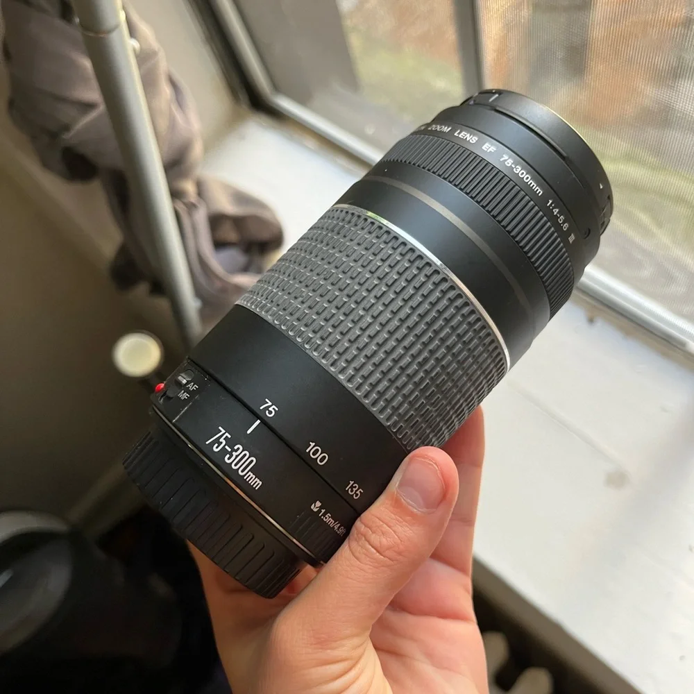 Canon Camera with case, charger, zoom lens and SD card to Apple converter